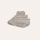 Ritual Bath Sheet Set by Rest & Reset neatly folded, showcasing plush organic cotton and clean design