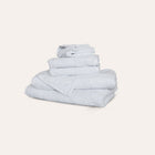 Ritual Bath Sheet Set by Rest & Reset folded in a lighter shade, showcasing softness and refined finishing