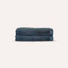 Oasis Bath Sheets Pair by Rest & Reset folded in a darker shade, highlighting thickness and organic cotton quality