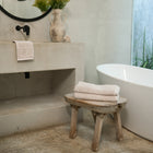 Ritual Hand Towels Pair by Rest & Reset styled on a bathroom bench, adding warmth and softness to the space