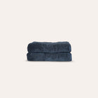 Ritual Hand Towels Pair by Rest & Reset folded in a darker shade, highlighting plush organic cotton fabric