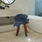 Ritual Hand Towels Pair by Rest & Reset styled on a wooden bench, combining function with relaxed luxury