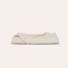 Murmur Quilt by Rest & Reset neatly folded, showcasing clean lines and premium organic cotton fabric