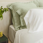 Murmur Euro Sham by Rest & Reset styled with natural elements, enhancing a relaxed and organic bedroom aesthetic