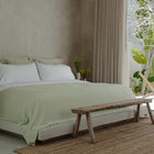 Murmur Euro Sham by Rest & Reset styled with warm wood accents, emphasizing comfort and timeless design