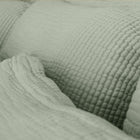 Close-up view of organic cotton fabric on Murmur Pillow Sham by Rest & Reset, showing subtle texture and finish