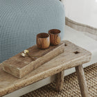 Murmur Quilt by Rest & Reset styled with bedside details, supporting a warm and serene bedroom setting
