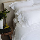 Murmur Euro Sham by Rest & Reset styled in soft lighting, enhancing warmth and relaxation in the bedroom