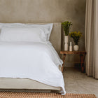 Murmur Quilt by Rest & Reset styled on a light-toned bed, supporting an airy and calm sleep environment