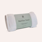 Wrapped organic cotton and wellness item from The Ritual Box by Rest & Reset, emphasizing thoughtful presentation