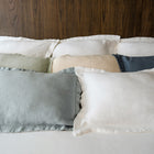 Waves Pillow Sham by Rest & Reset styled on a light-toned bed, creating an airy and calm sleep environment