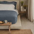 Waves Pillow Sham by Rest & Reset styled on a made bed from the front, designed for everyday layered comfort
