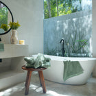 Oasis Washcloths Pair by Rest & Reset styled with natural elements, enhancing a fresh and spa-inspired bathroom feel