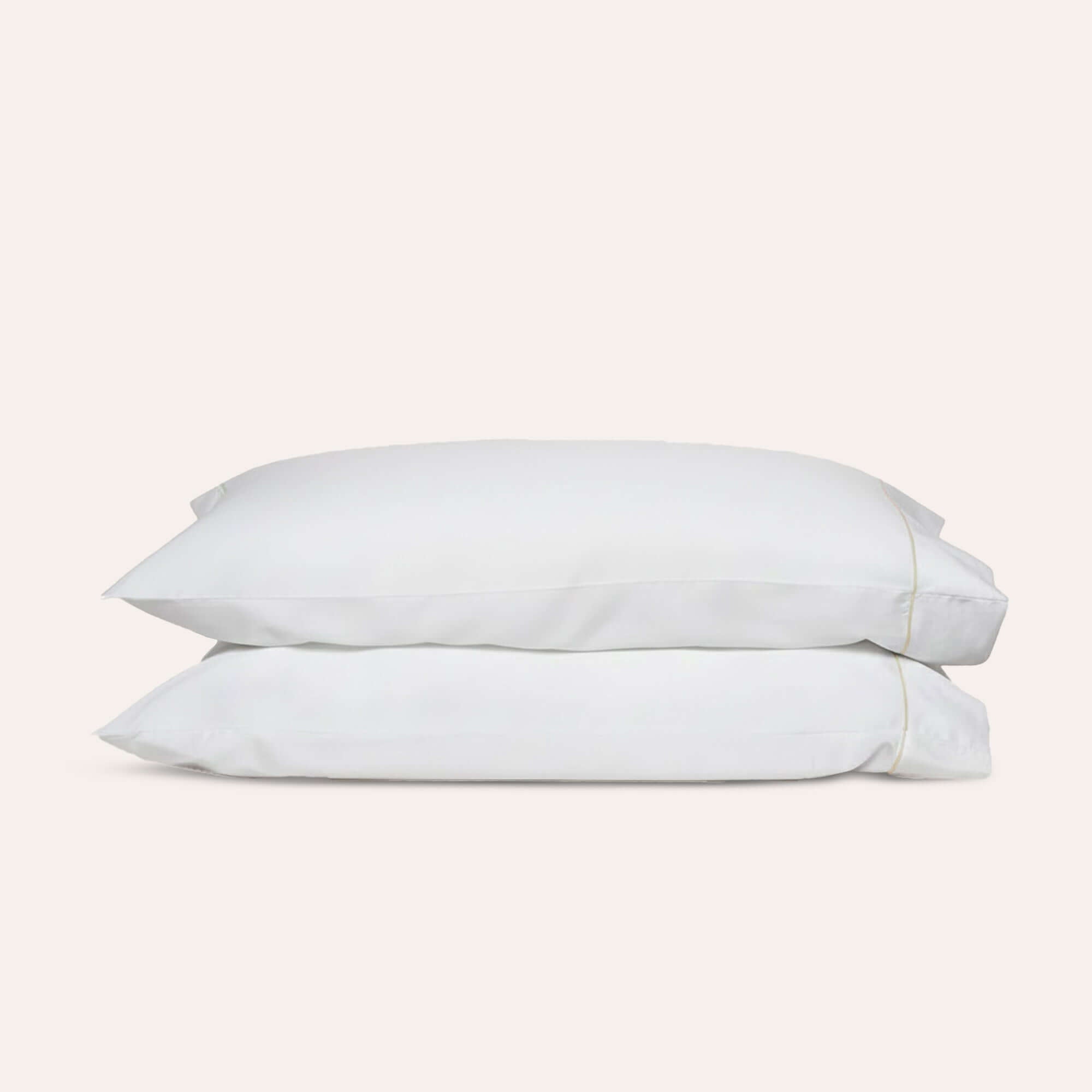 Serene Pillowcase Pair by Rest & Reset neatly folded, showcasing clean lines and premium organic cotton fabric