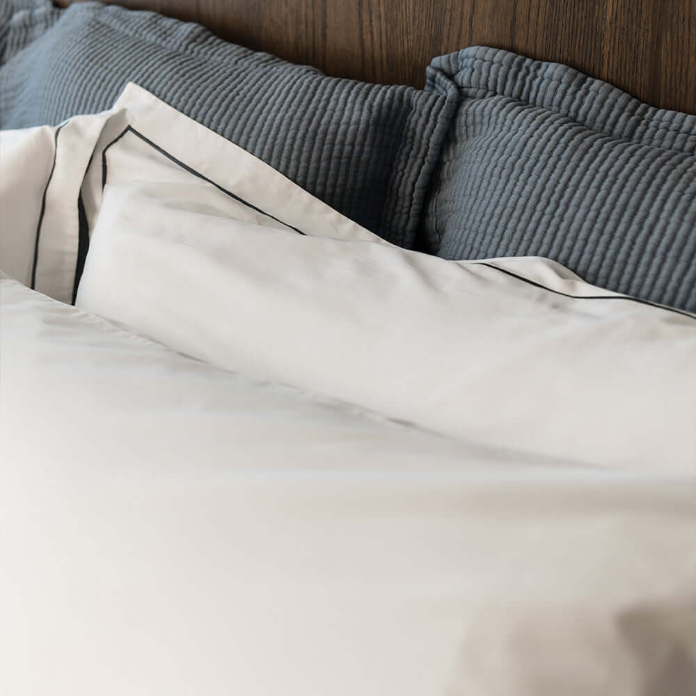 Serene organic cotton Euro sham by Rest & Reset styled on a full bed, designed for layered comfort and refined sleep spaces