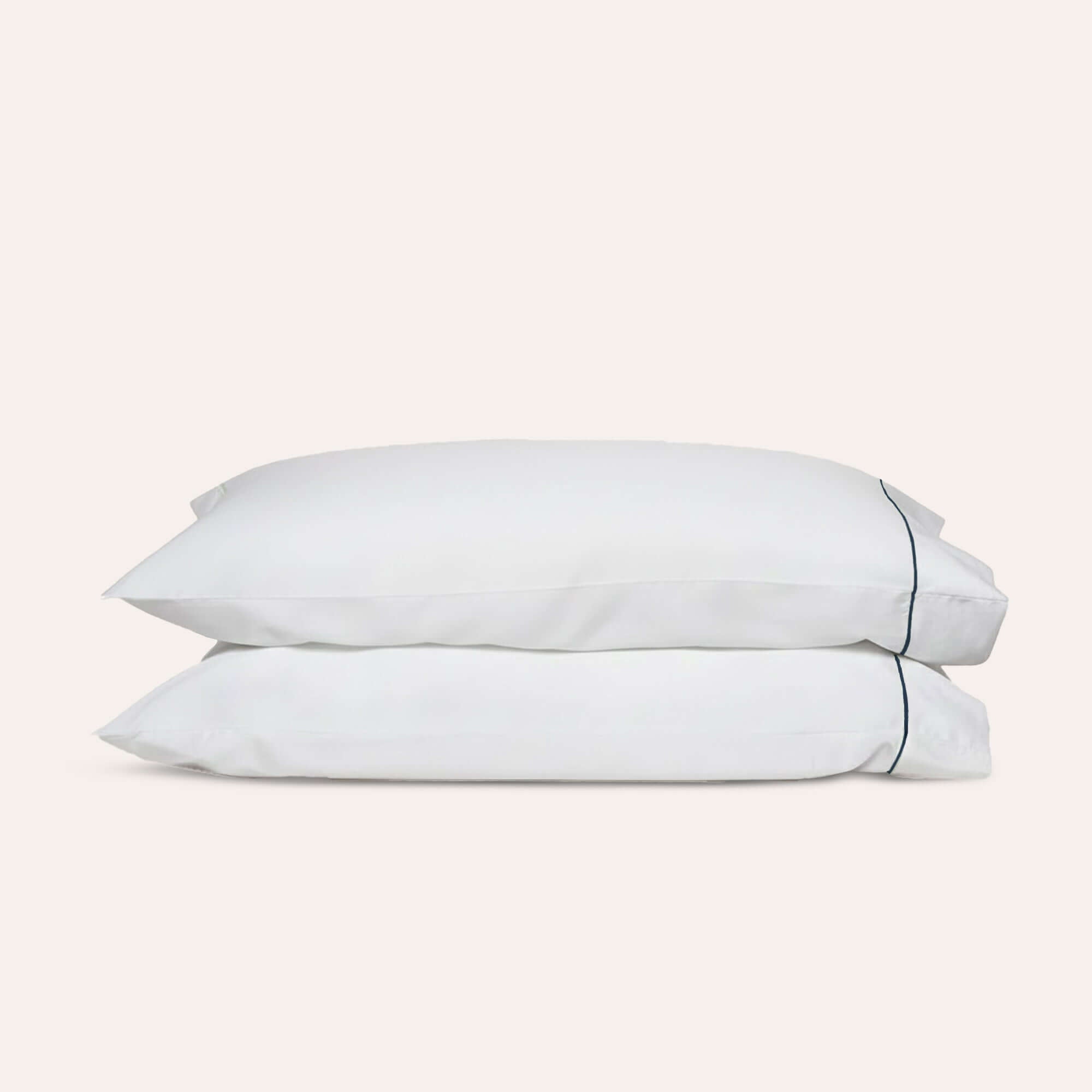 Serene Pillowcase Pair by Rest & Reset shown folded from the front, highlighting breathable organic cotton material