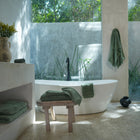 Ritual Bath Sheet Set by Rest & Reset styled in natural light, highlighting texture and soothing tones