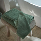 Close-up of organic cotton terry fabric on the Ritual Bath Sheet Set by Rest & Reset, showing plush absorbency