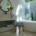 Ritual Bath Sheet Set by Rest & Reset styled in a serene bathroom, creating a calm and elevated bathing experience