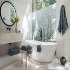 Ritual Bath Sheet Set by Rest & Reset styled near a window, creating a fresh and calming bathroom atmosphere