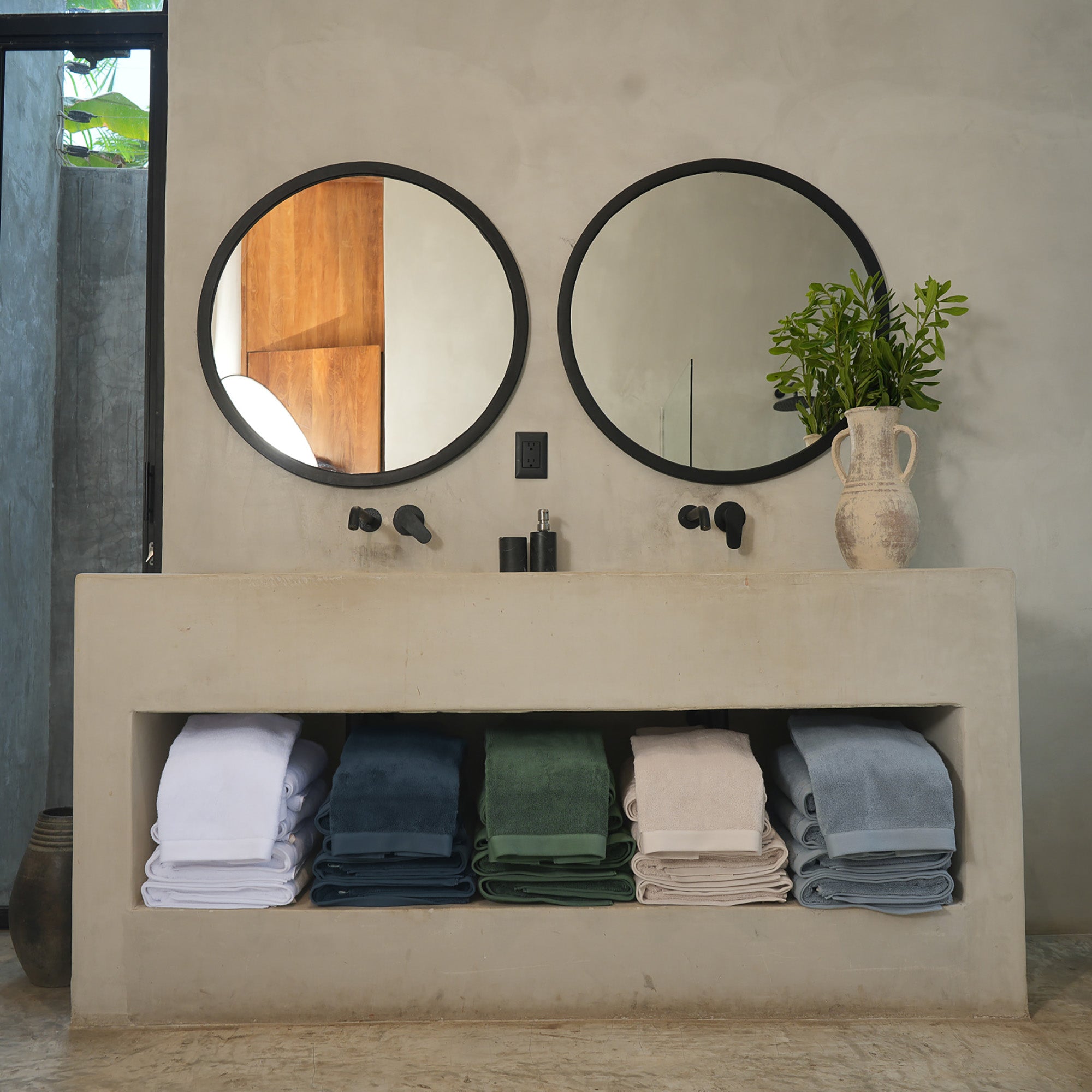 Oasis Bath Sheet Set by Rest & Reset styled with bathroom accessories, emphasizing mindful daily rituals