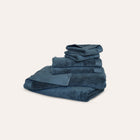 Oasis Bath Sheet Set by Rest & Reset folded in a darker shade, highlighting plush organic cotton fabric
