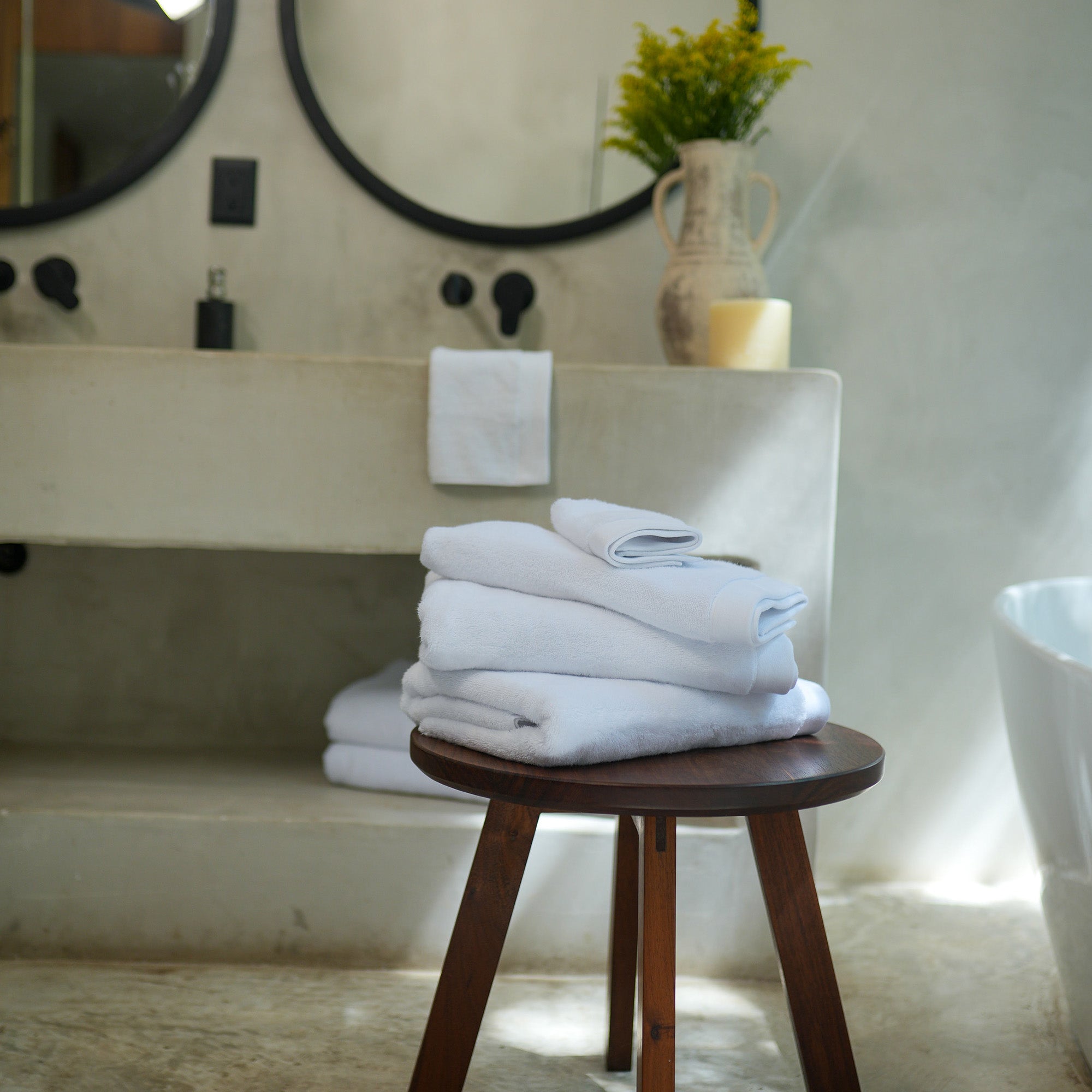 Oasis Bath Sheets Pair by Rest & Reset styled with bath accessories, enhancing a spa-like bathroom atmosphere
