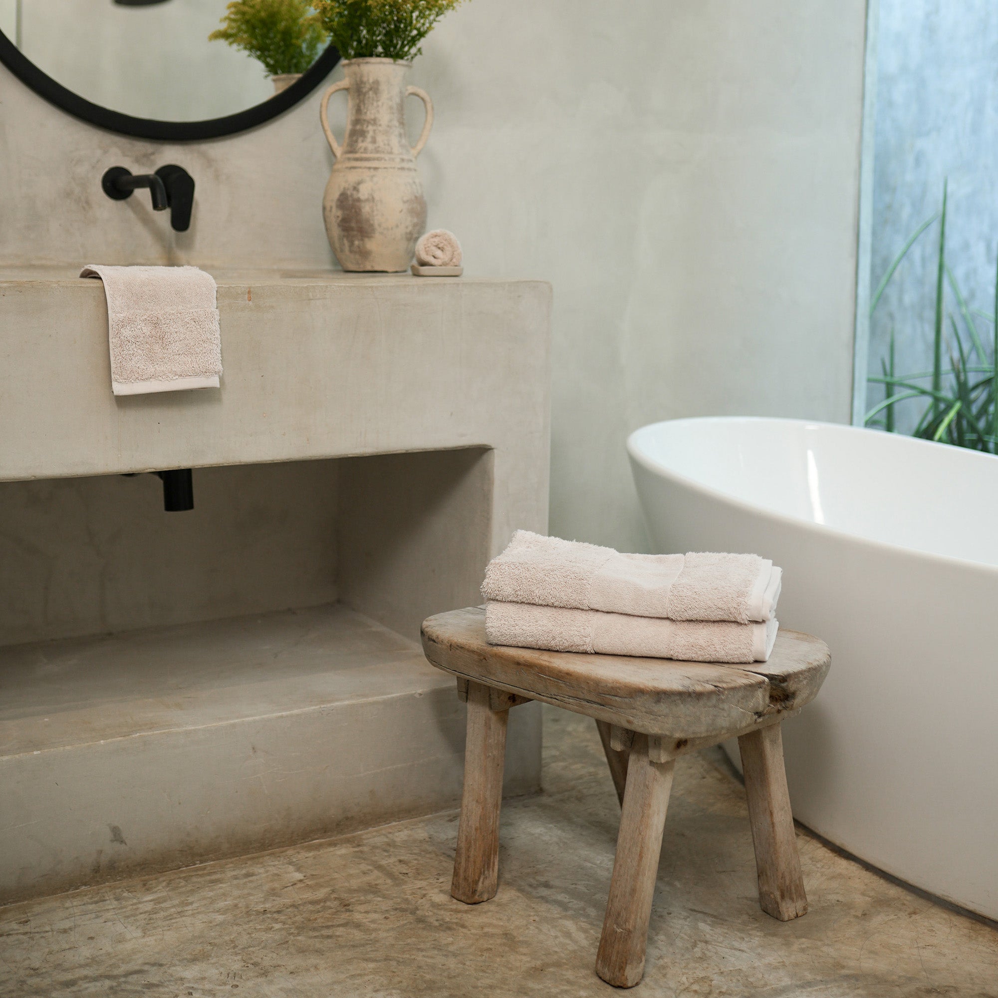 Ritual Bath Towels Pair by Rest & Reset styled on a bathroom bench, adding warmth and softness to the space