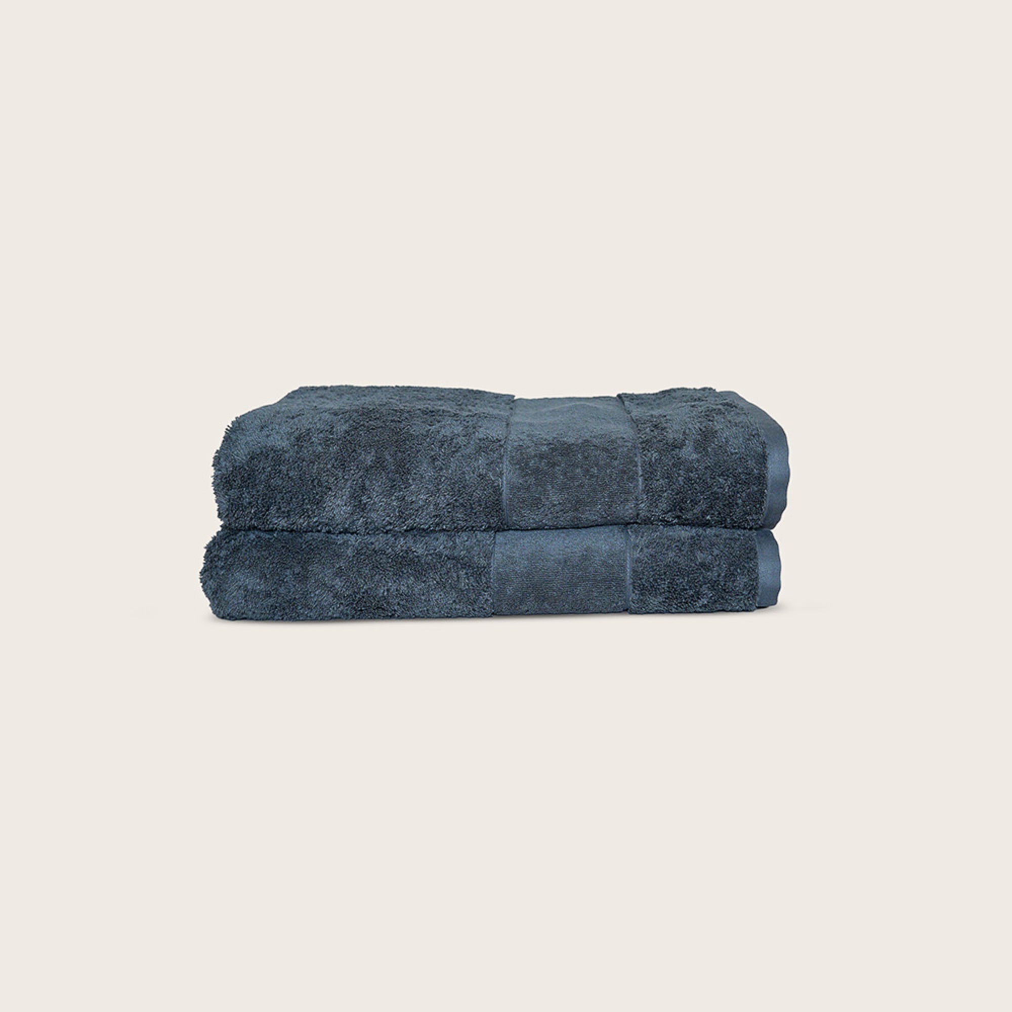 Ritual Bath Towels Pair by Rest & Reset folded in a darker shade, highlighting plush organic cotton fabric