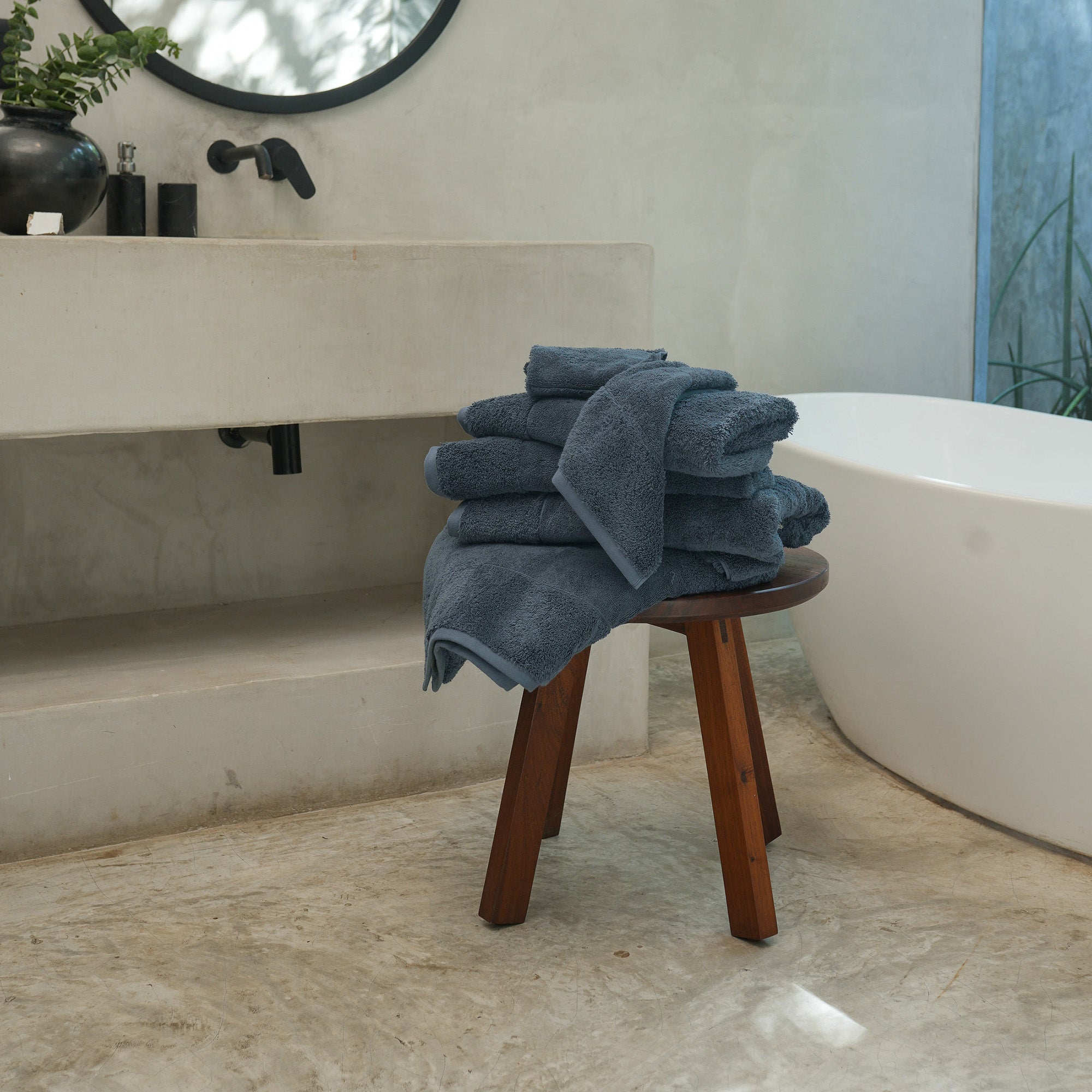 Ritual Bath Towels Pair by Rest & Reset styled on a wooden bench, combining functionality with relaxed luxury