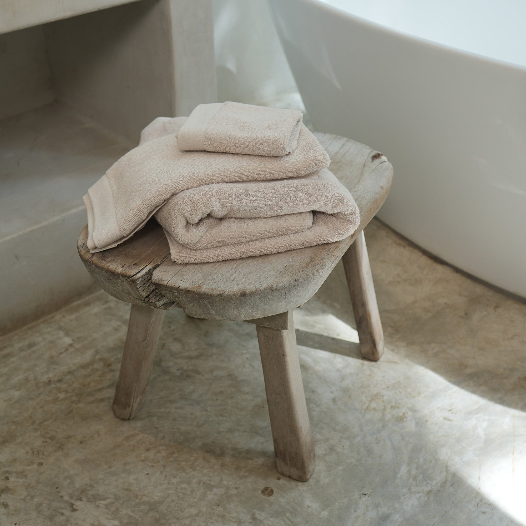Oasis Bath Towels Pair by Rest & Reset stacked on a bathroom surface, emphasizing softness and thickness