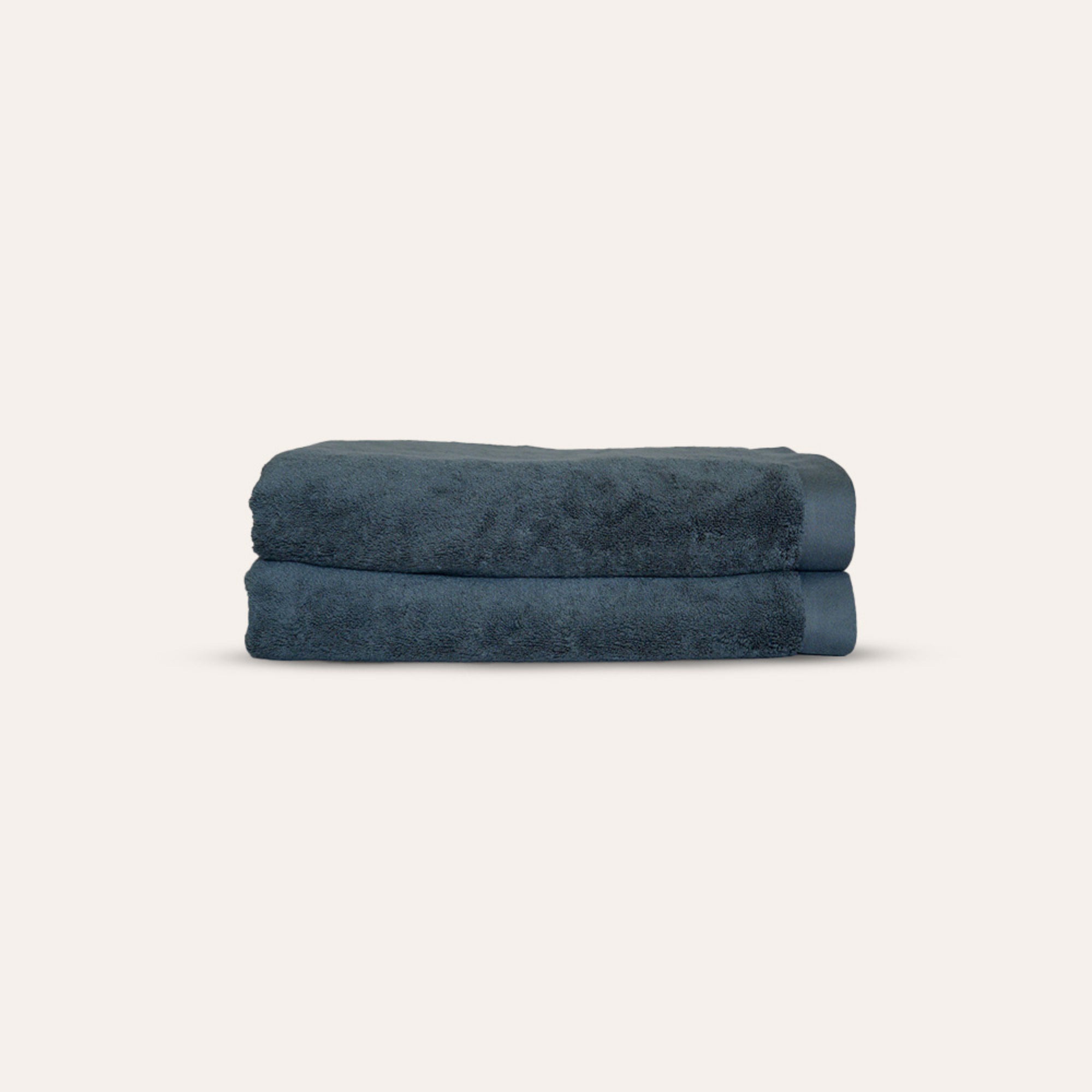 Oasis Bath Towels Pair by Rest & Reset folded in a darker shade, highlighting thickness and organic cotton quality