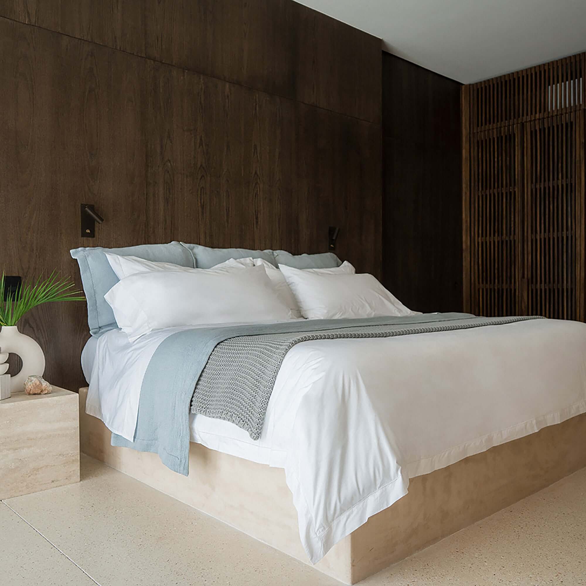 Organic cotton Whisper Throw Blanket by Rest & Reset styled on a bed, adding comfort, texture, and calm to the space