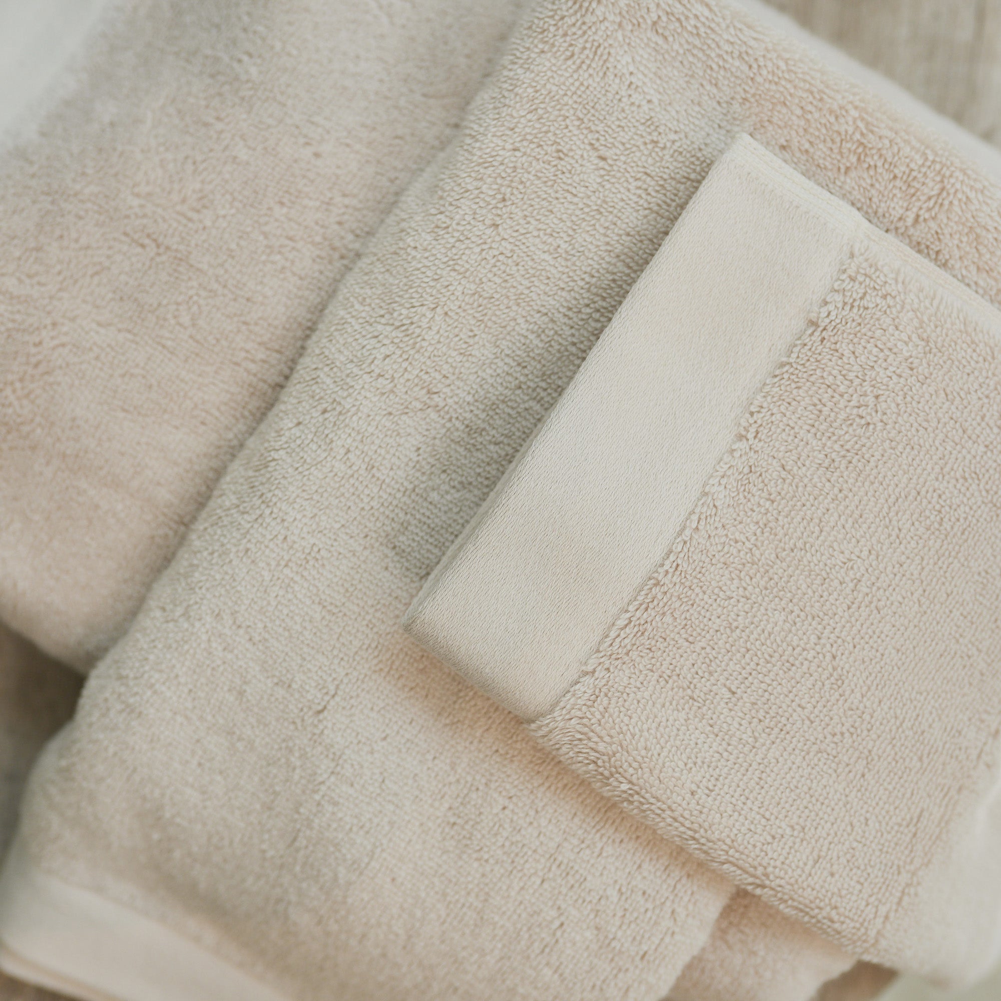 Close-up of organic cotton terry fabric on Oasis Hand Towels Pair by Rest & Reset, highlighting softness and absorbency