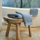 Oasis Hand Towels Pair by Rest & Reset styled on a bathroom bench, adding softness and warmth to the space