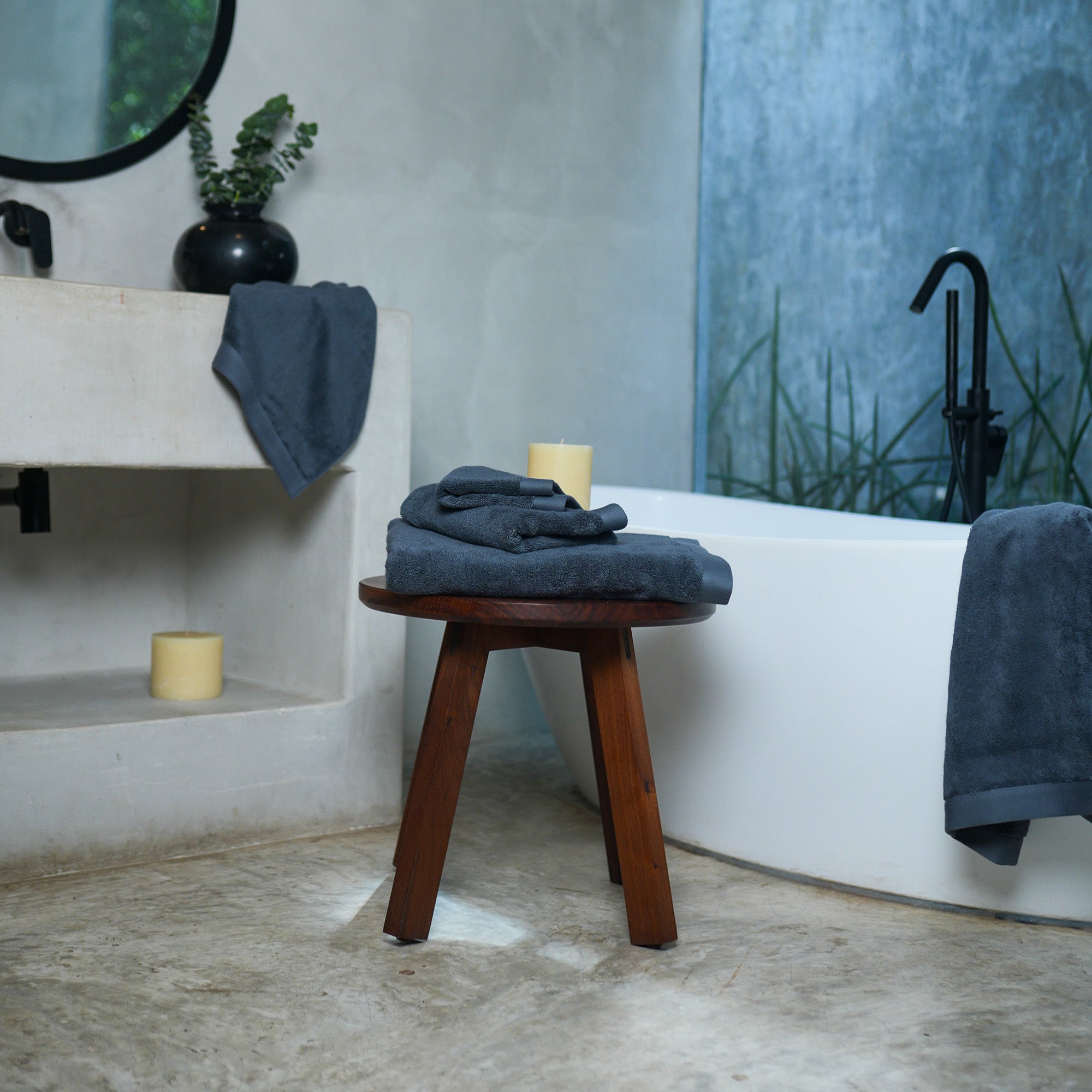 Oasis Hand Towels Pair by Rest & Reset styled on a wooden bench, combining functionality with relaxed luxury