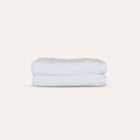 Oasis Hand Towels Pair by Rest & Reset folded in a lighter shade, showcasing softness and clean finishing