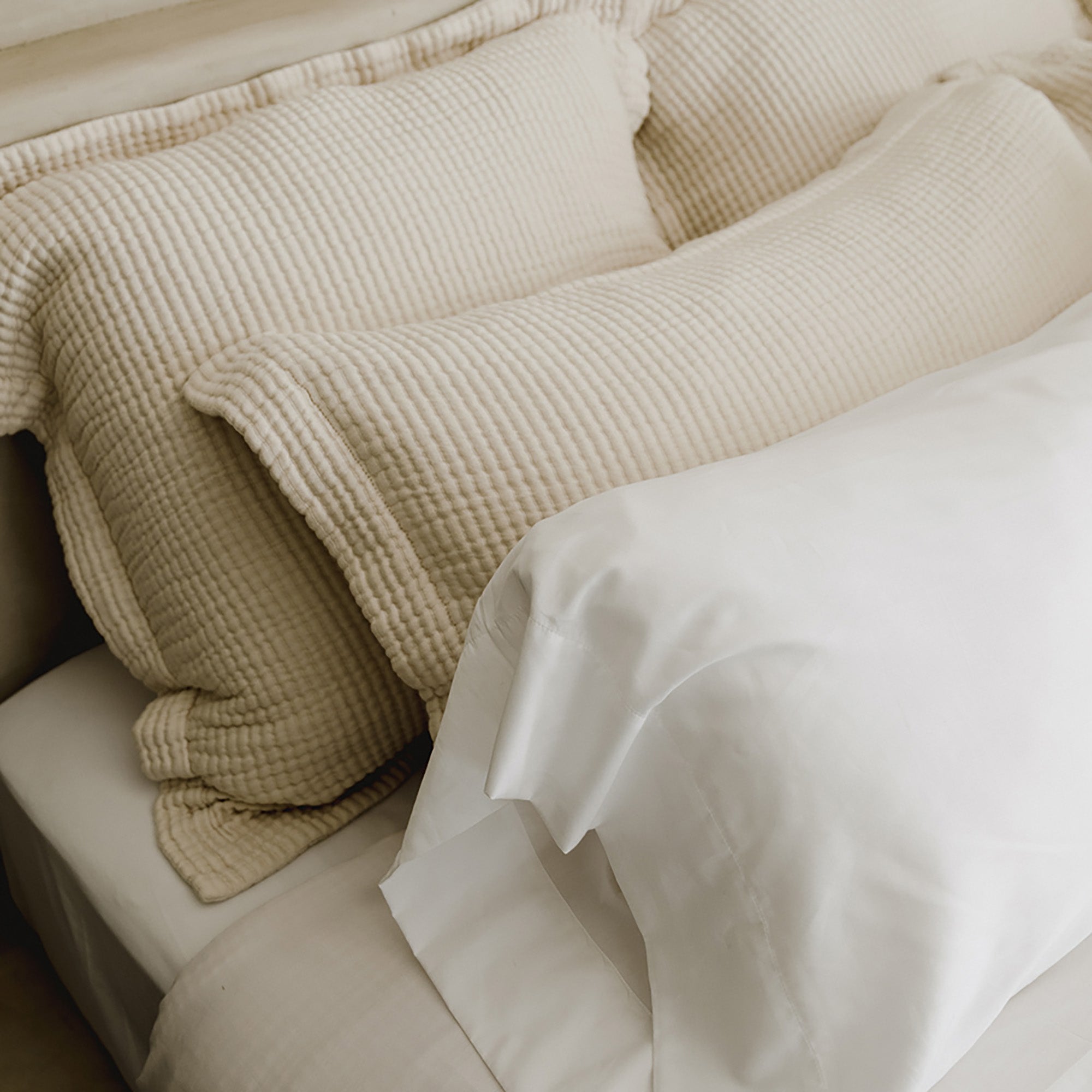 Close-up of organic cotton weave on Murmur Pillow Sham by Rest & Reset, emphasizing breathability and soft hand feel
