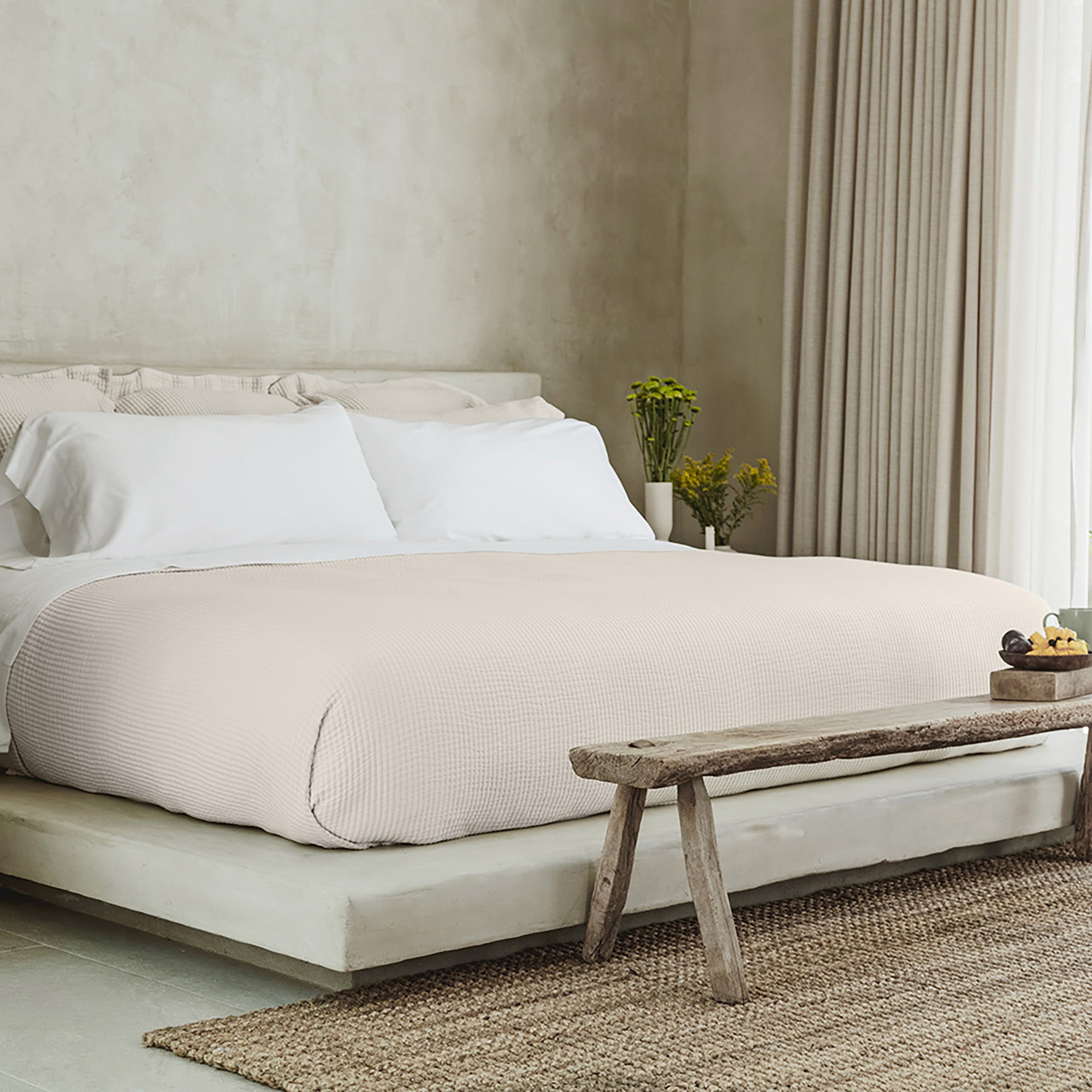 Murmur Pillow Sham by Rest & Reset styled with warm wood accents, enhancing a calm and timeless bedroom aesthetic