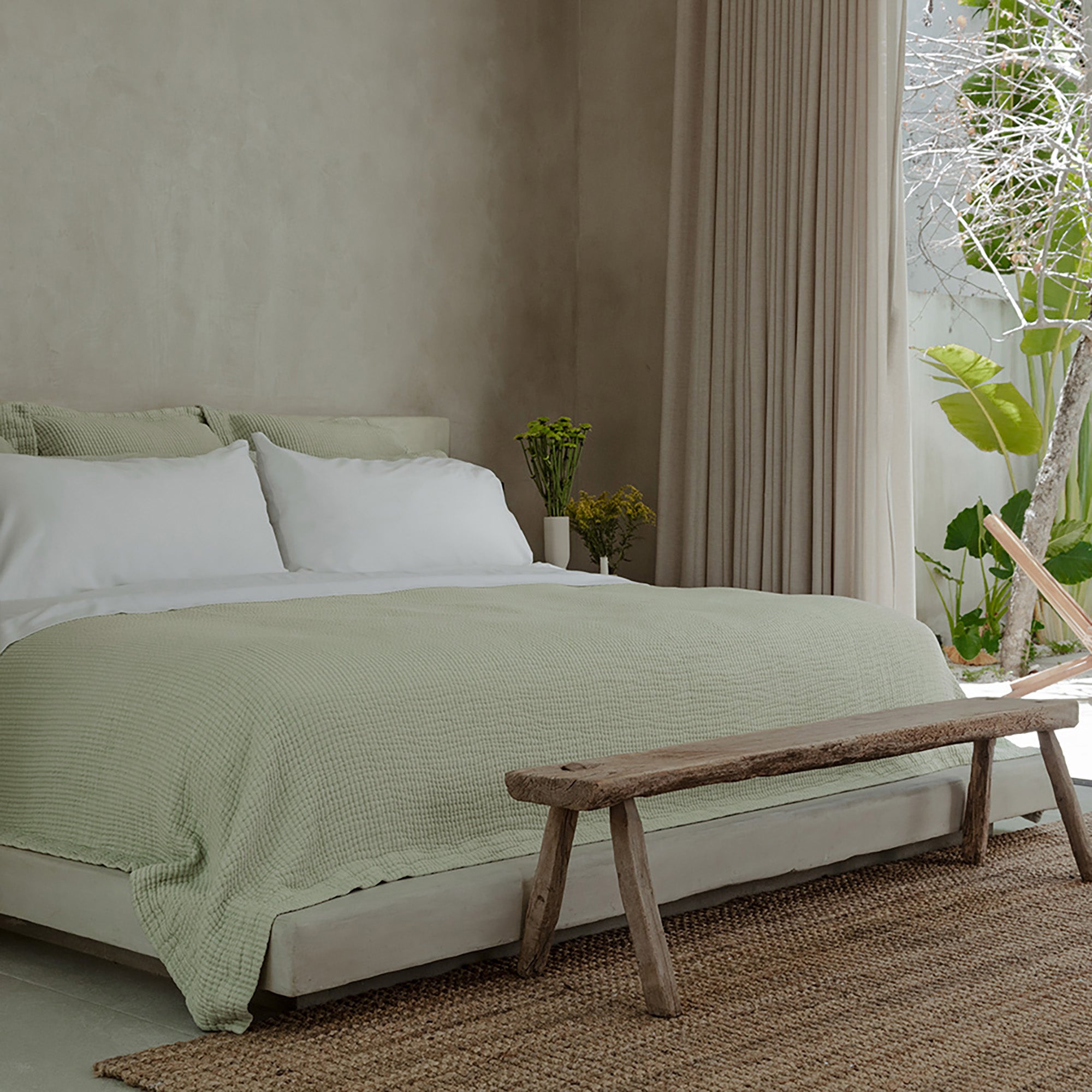 Murmur Euro Sham by Rest &amp; Reset styled with warm wood accents, emphasizing comfort and timeless design