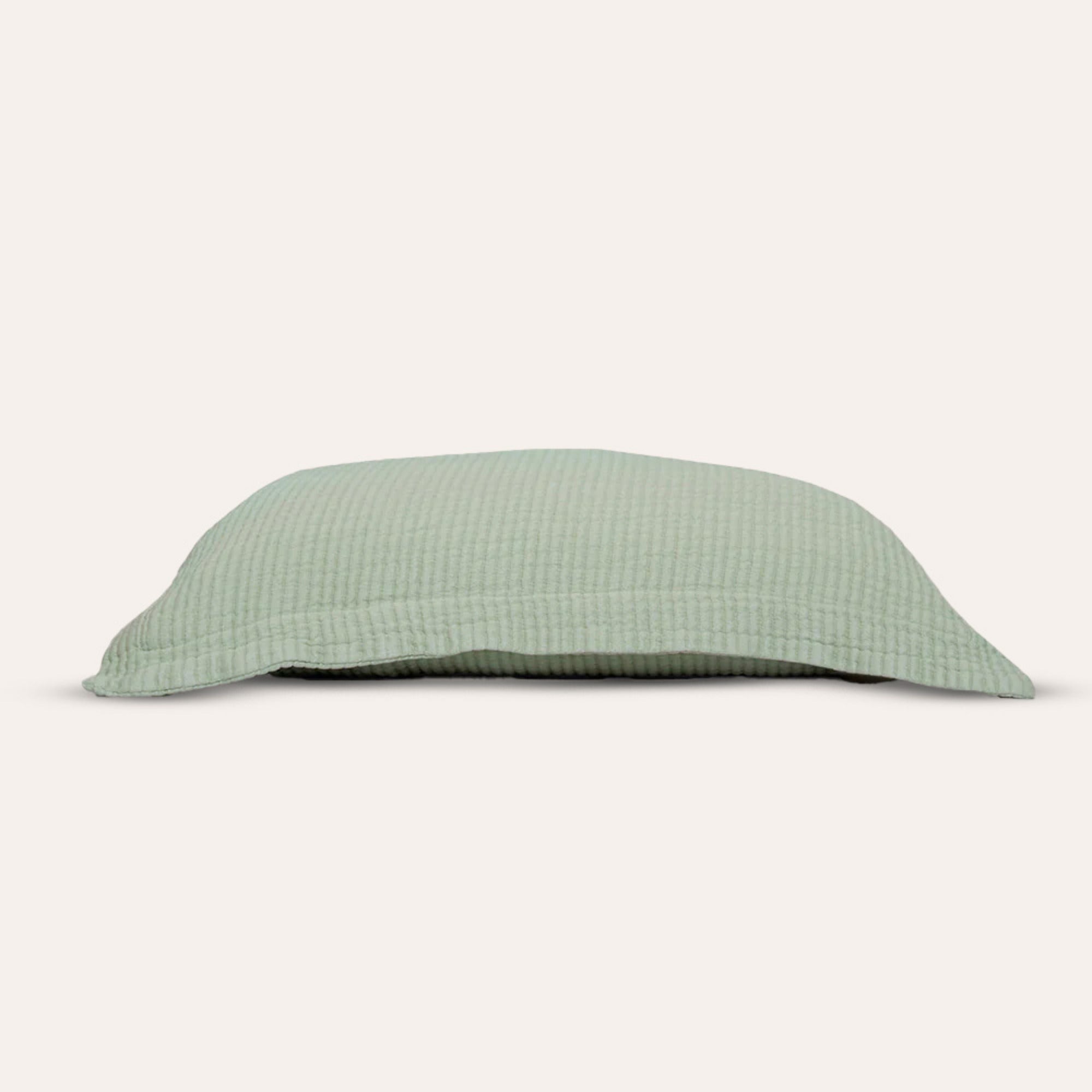 Murmur Pillow Sham by Rest & Reset displayed folded, highlighting clean lines and organic cotton softness