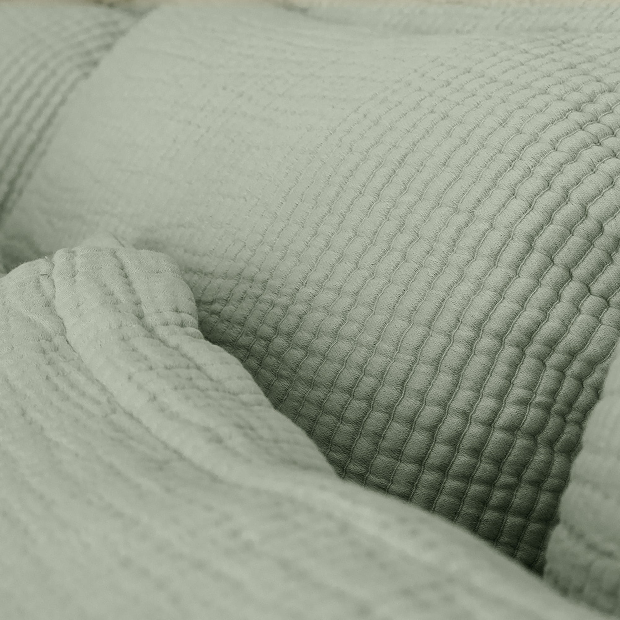 Close-up view of organic cotton fabric on Murmur Pillow Sham by Rest & Reset, showing subtle texture and finish