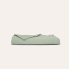 Murmur Quilt by Rest & Reset displayed folded, highlighting organic cotton softness and craftsmanship