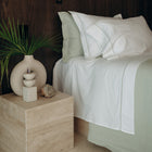 Murmur Quilt by Rest & Reset paired with matching pillows, creating a cohesive and restful bedroom look