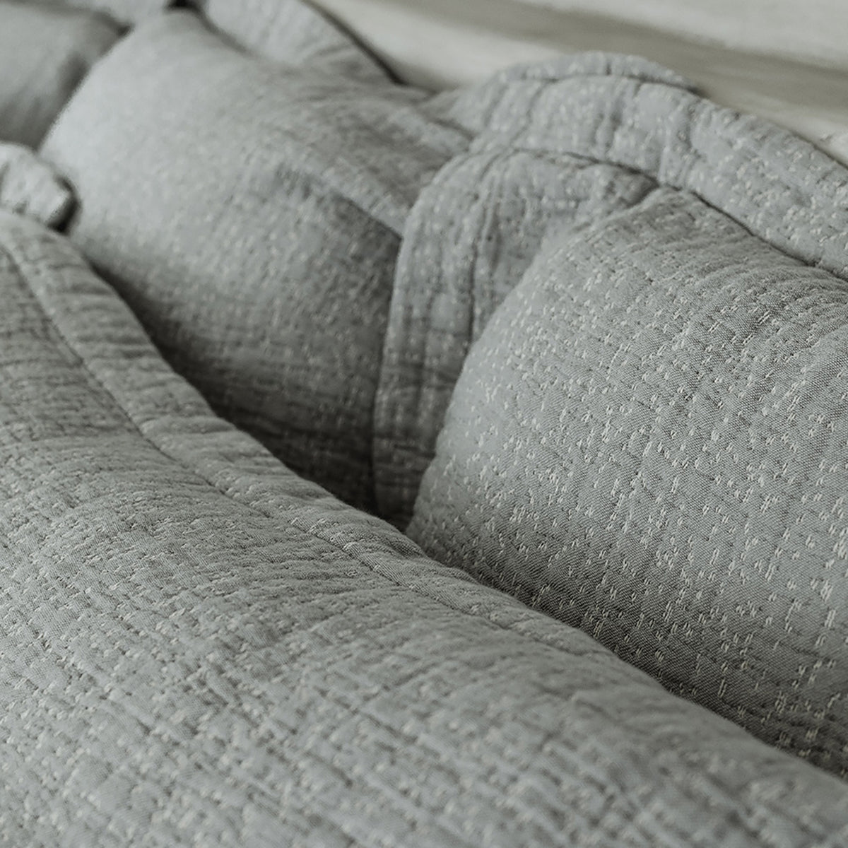 Close-up of organic cotton fabric on Veil Euro Sham by Rest & Reset, highlighting gentle texture and relaxed finish