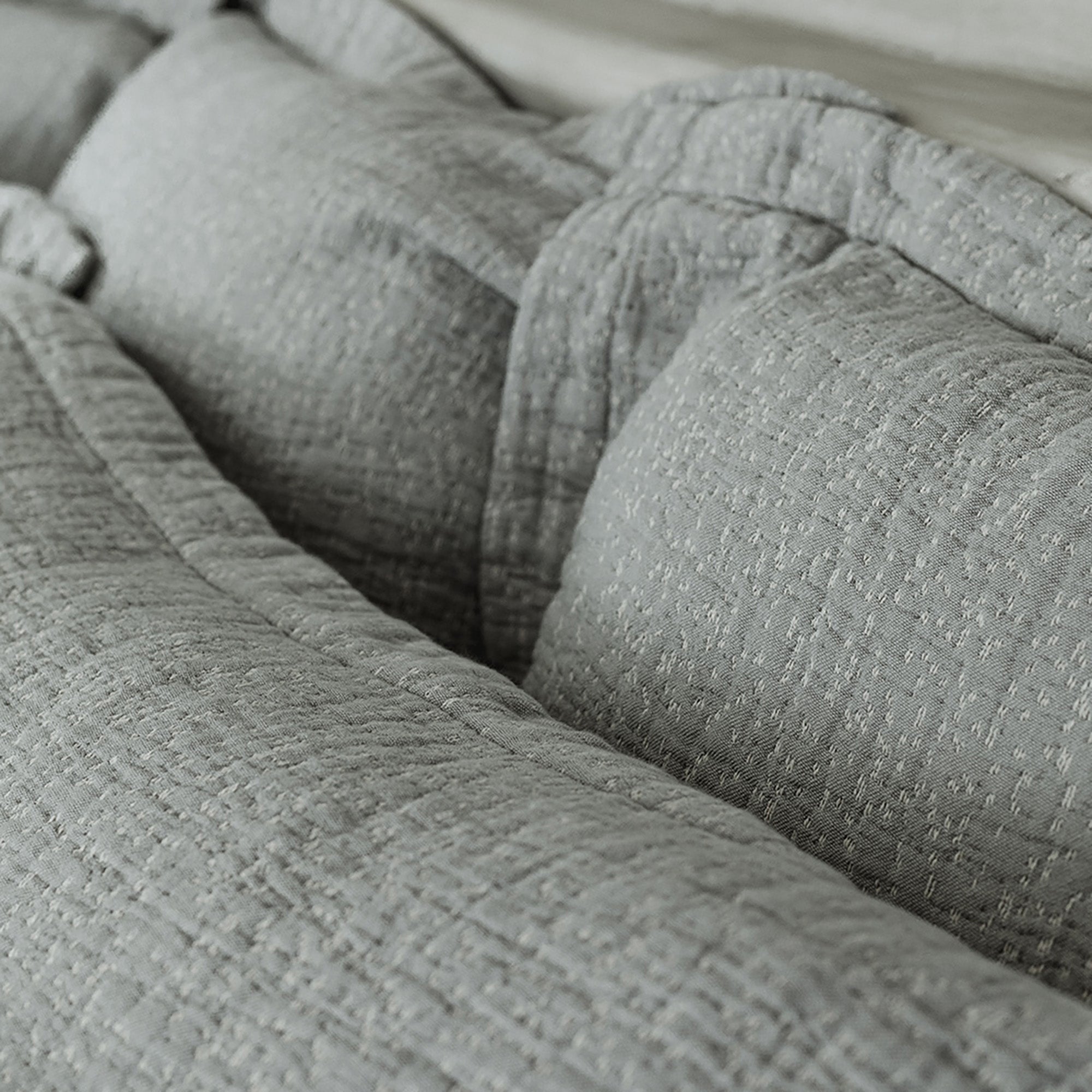 Close-up of organic cotton fabric on Veil Euro Sham by Rest & Reset, highlighting gentle texture and relaxed finish