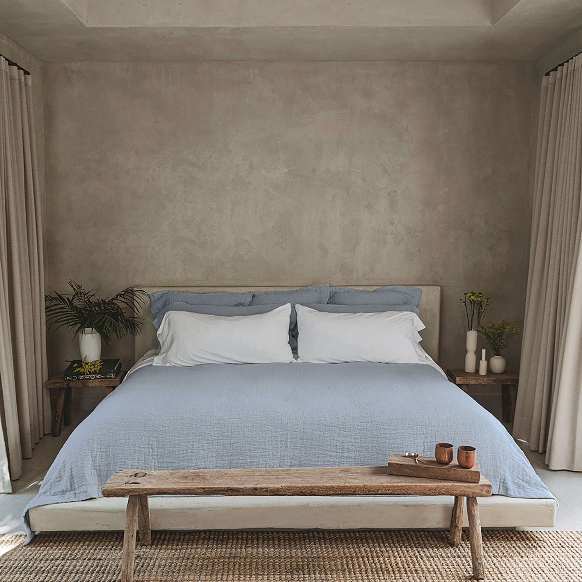 Veil Quilt by Rest & Reset layered on a made bed, designed for breathable warmth and everyday rest