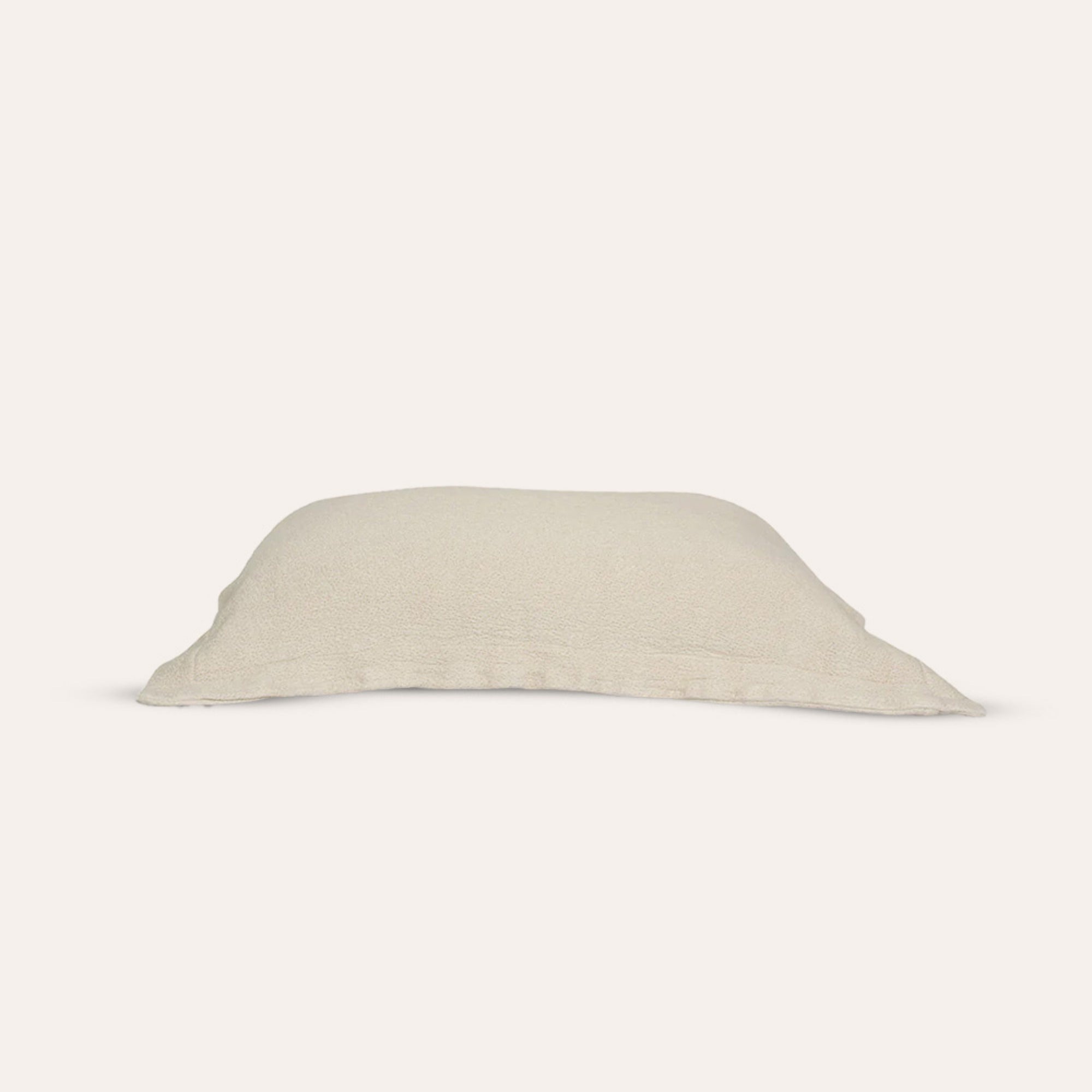 Waves Pillow Sham by Rest & Reset neatly folded, showcasing premium organic cotton and clean lines