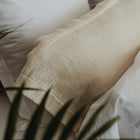 Close-up of organic cotton surface on Waves Pillow Sham by Rest & Reset, emphasizing softness and relaxed structure