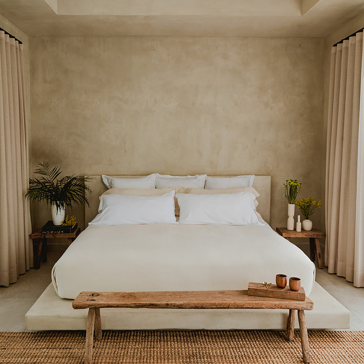 Minimalist bedroom scene with Waves Quilt crafted from organic cotton luxury bedding by Rest & Reset